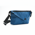 Blue crossbody bag on white square background